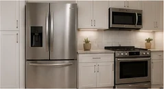 Kitchen appliances including refrigerator, range, and microwave
